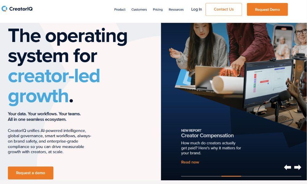 CreatorIQ homepage hero headlined as the operating system for creator-led growth, with a team working at a desk beside a campaign dashboard and a creator-compensation report callout.
