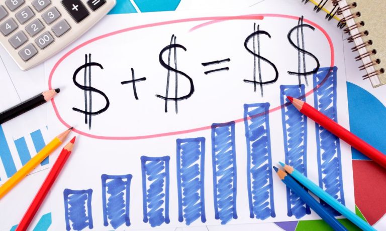 Hand-drawn math equation showing dollar signs adding up to a larger result, surrounded by hand-drawn bar charts, colored pencils, and a calculator